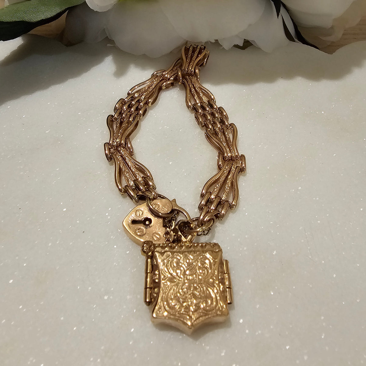 9ct Rose Gold 4 Bar Gate Bracelet with Garnet Locket
